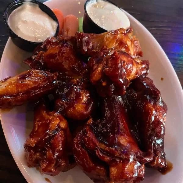 Adobo BBQ wings with carrots, celery and dipping sauce, photographed by The False 9