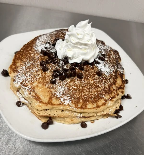 Chocolate chip pancakes with whipped topping at The False 9